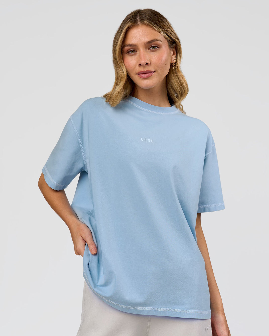 Woman wearing Go-To Contrast Oversized Heavyweight FLXCotton Tee - Open Air Washed-White | Model:Leilani | Size:XS