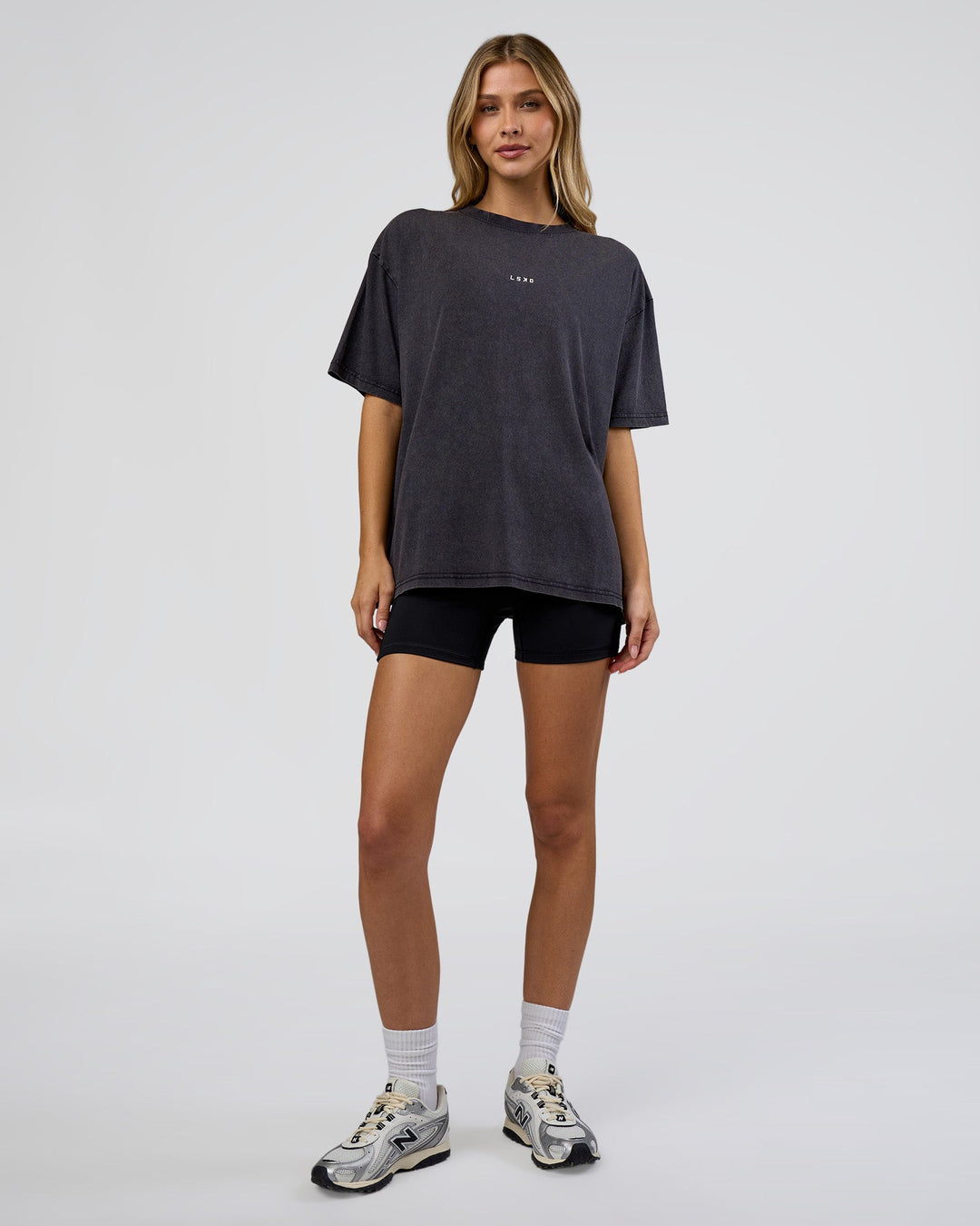 Woman wearing Go-To FLXCotton Oversized Tee - Black Washed-White | Model:Leilani | Size:S