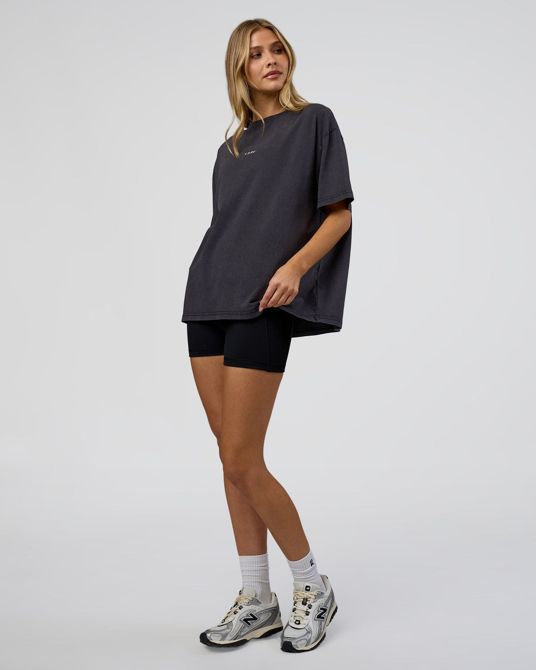 Woman wearing Go-To FLXCotton Oversized Tee - Black Washed-White | Model:Leilani | Size:S