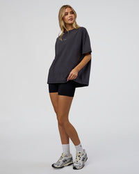 Woman wearing Go-To FLXCotton Oversized Tee - Black Washed-White | Model:Leilani | Size:S