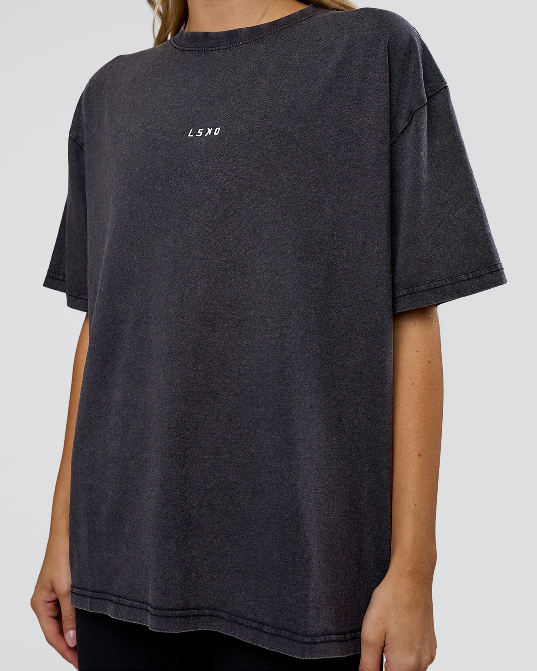 Woman wearing Go-To FLXCotton Oversized Tee - Black Washed-White | Model:Leilani | Size:S