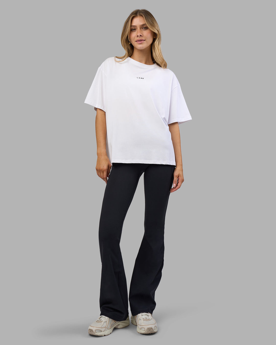 Woman wearing Go-To FLXCotton Oversized Tee - White-Black | Model:Leilani | Size:XS