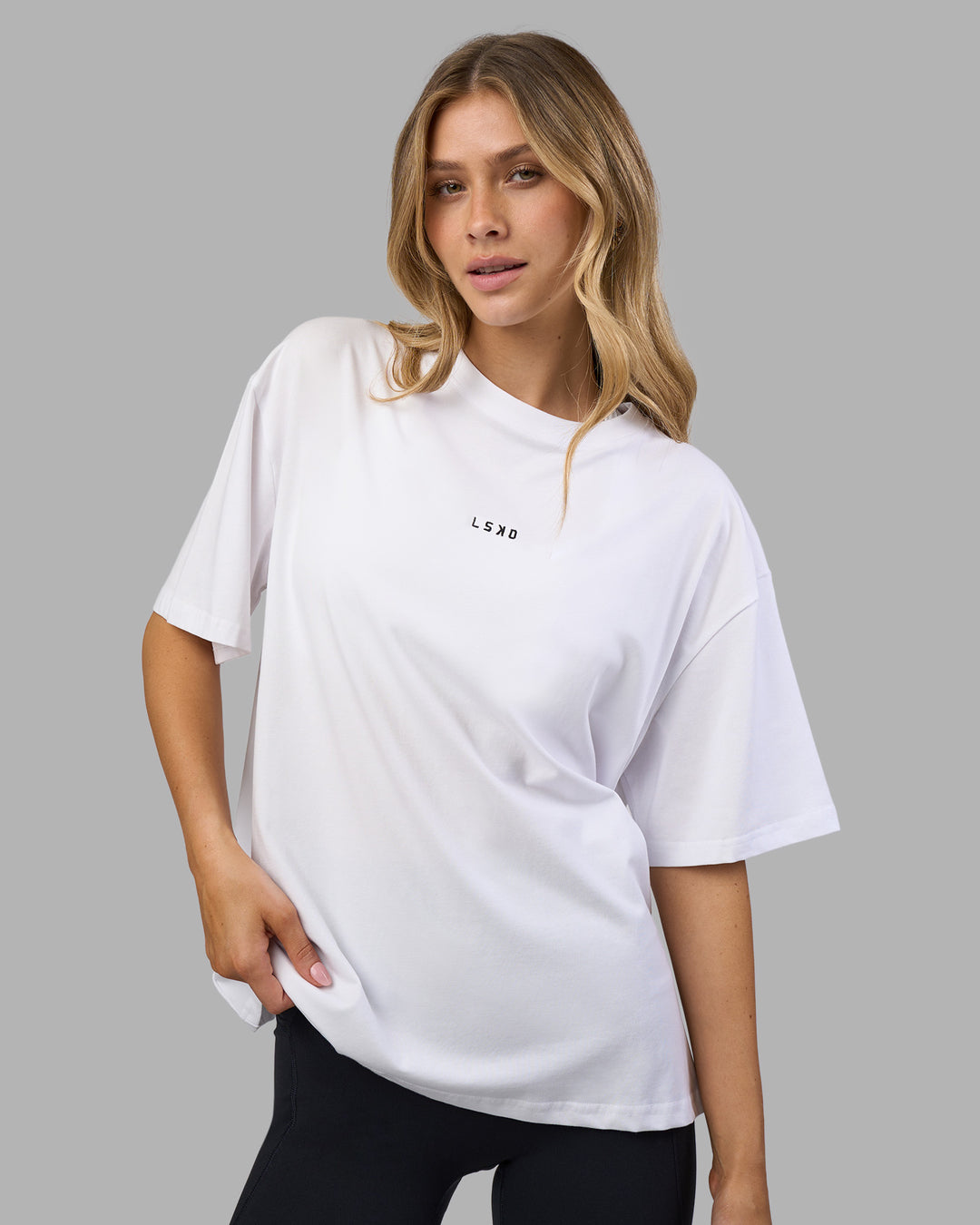 Woman wearing Go-To FLXCotton Oversized Tee - White-Black | Model:Leilani | Size:XS