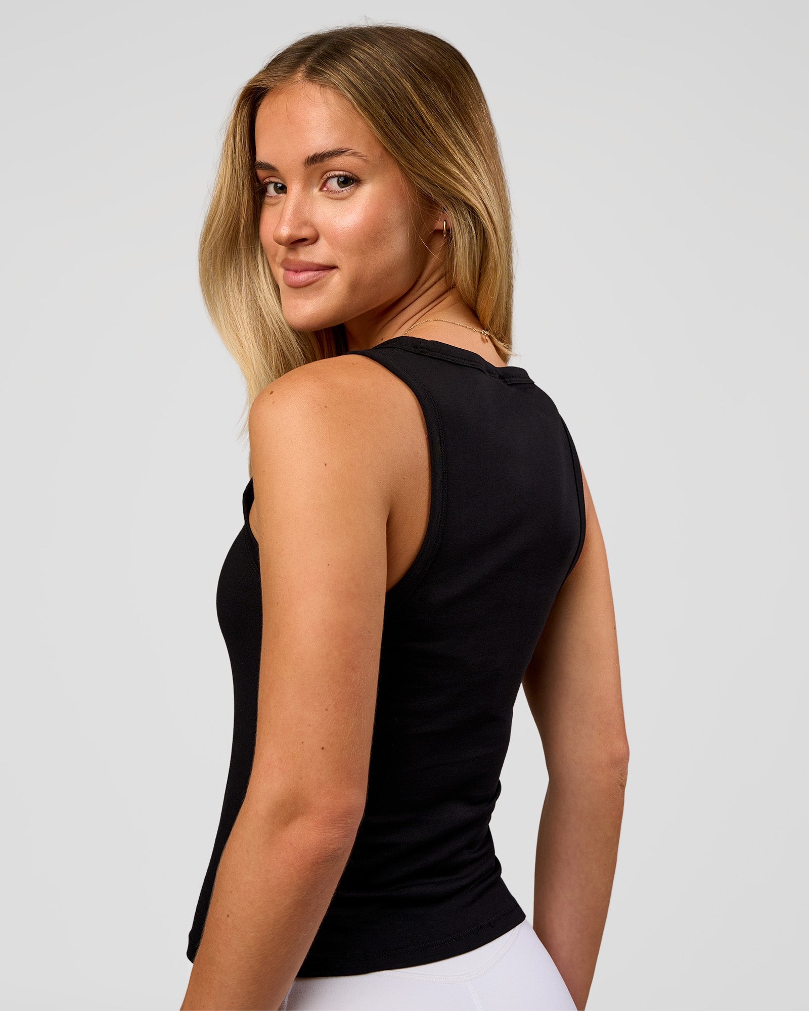 Woman wearing Go-To FLXCotton Scoop Neck Tank in Black-White | Model:Issy | Size:XS