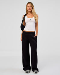 Woman wearing Go-To FLXCotton Scoop Neck Tank in White-Black | Model:Issy | Size:XS