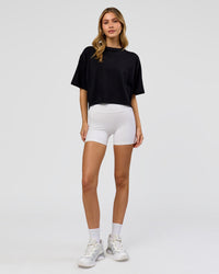 Woman wearing Go-To FLXCotton Skimmer Tee - Black-Black | Model:Leilani | Size:XS