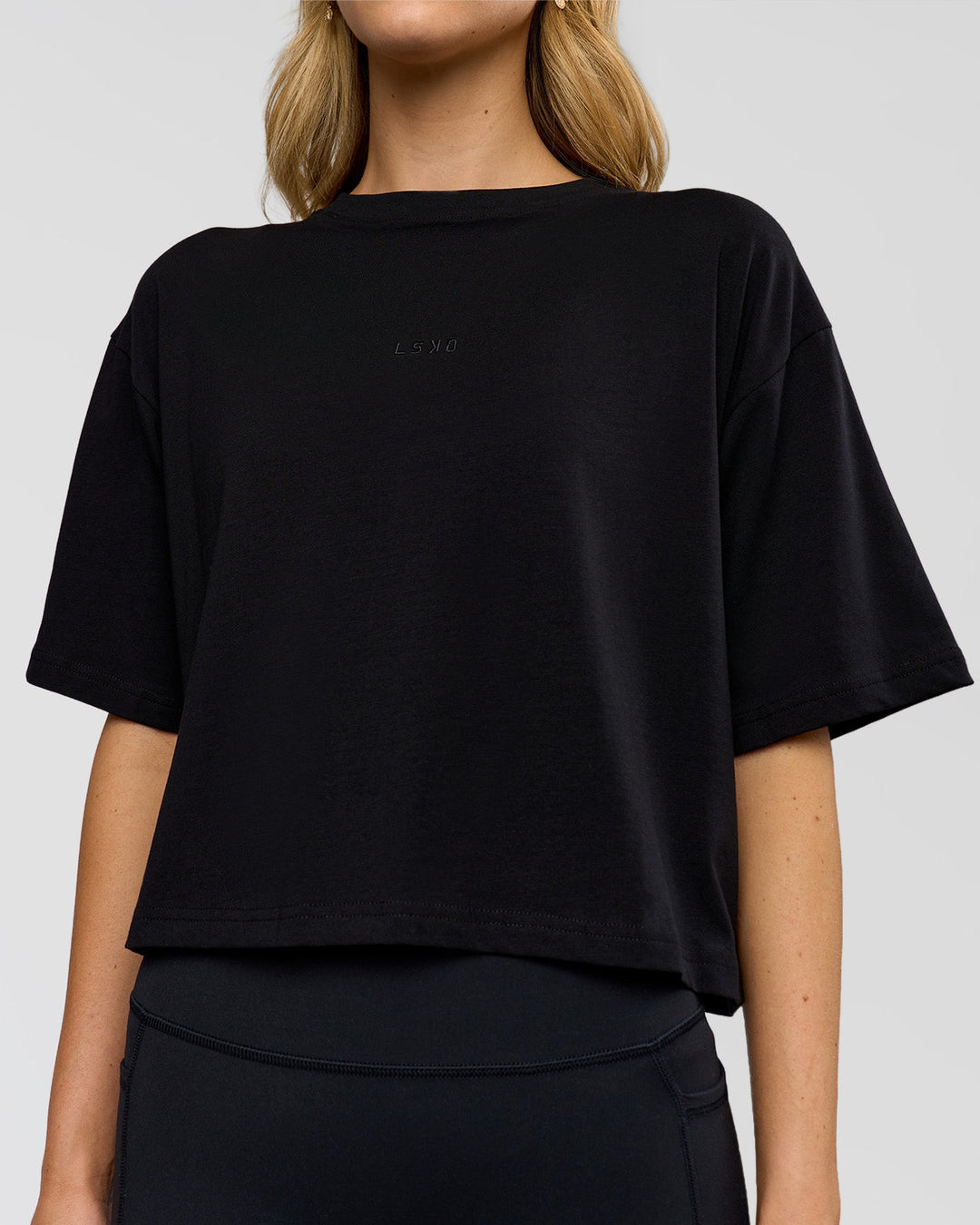 Woman wearing Go-To FLXCotton Skimmer Tee - Black-Black | Model:Leilani | Size:XS
