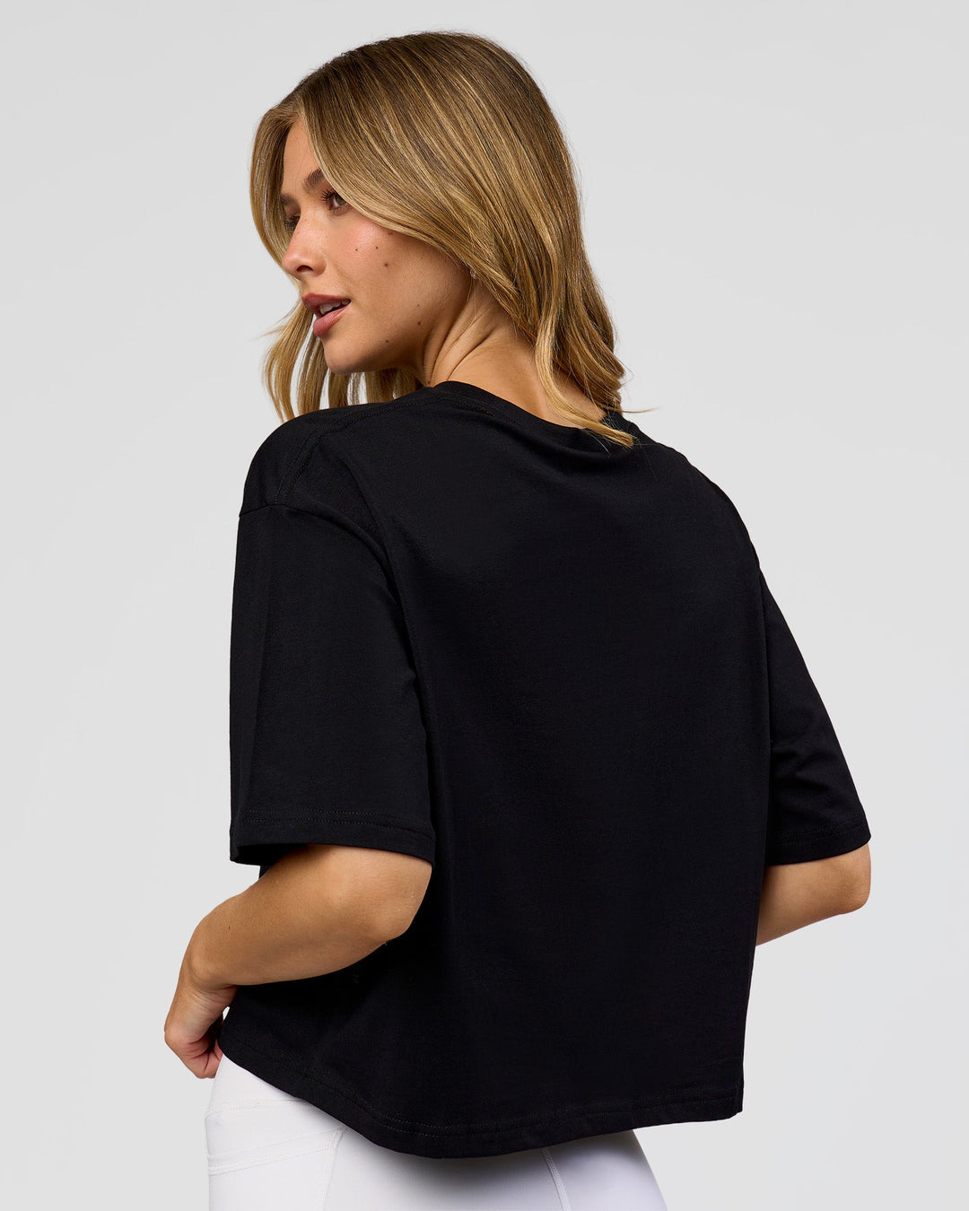 Woman wearing Go-To FLXCotton Skimmer Tee - Black-Black | Model:Leilani | Size:XS