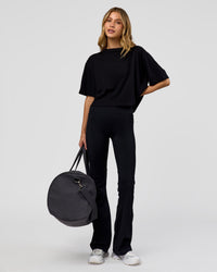 Woman wearing Go-To FLXCotton Skimmer Tee - Black-Black | Model:Leilani | Size:XS