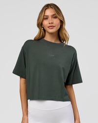 Woman wearing Go-To FLXCotton Skimmer Tee - Carbon Green-Carbon Green | Model:Leilani | Size:XS
