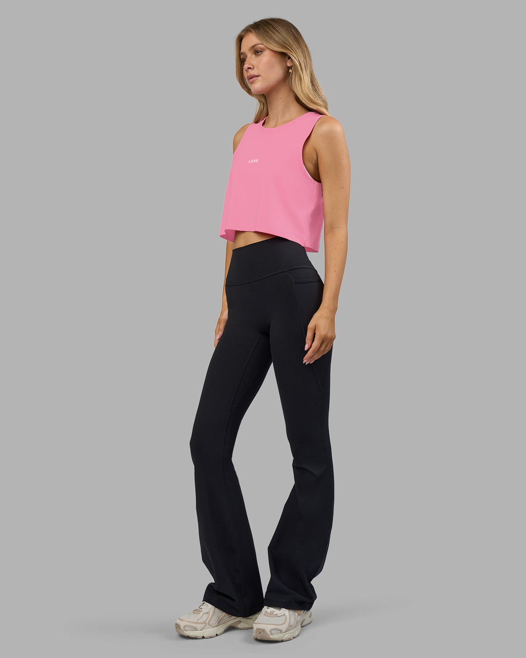 Woman wearing Go-To FLXCotton Tank - Candy Pink-White | Model:Leilani | Size:XS