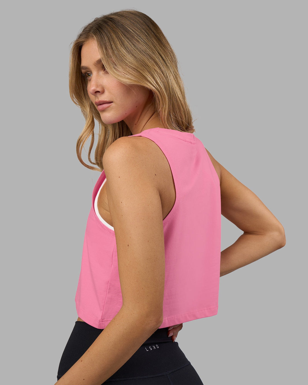 Woman wearing Go-To FLXCotton Tank - Candy Pink-White | Model:Leilani | Size:XS