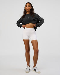 Woman wearing Go-To Long Sleeve FLXCotton Oversized Tee - Black Washed-White | Model:Jordan | SIze:XS