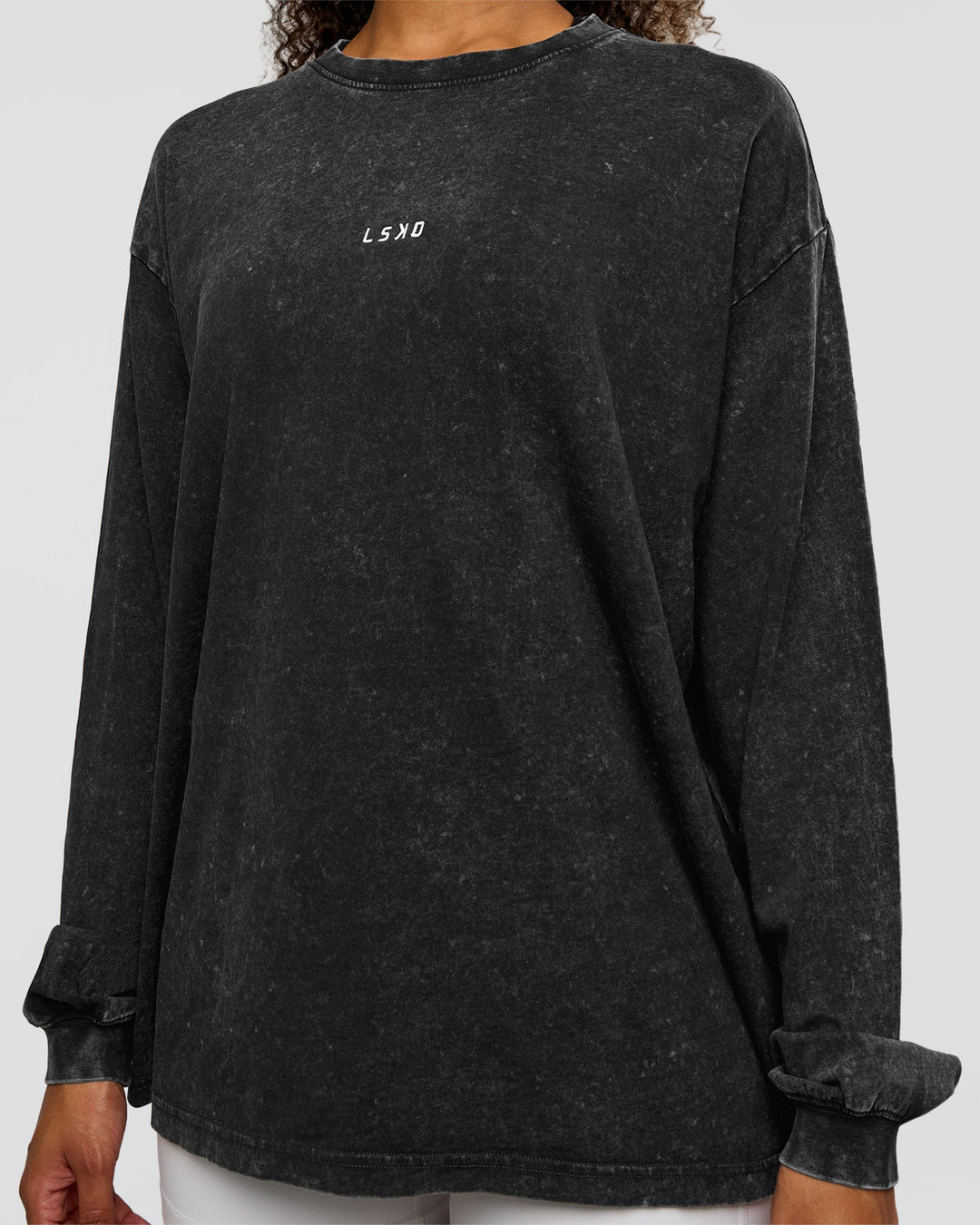 Woman wearing Go-To Long Sleeve FLXCotton Oversized Tee - Black Washed-White | Model:Jordan | SIze:XS