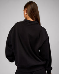 Woman wearing Go-To Oversized Quarter Zip Sweater - Black | Model:Brylee | Size:XS | Thumbnail Index: 3