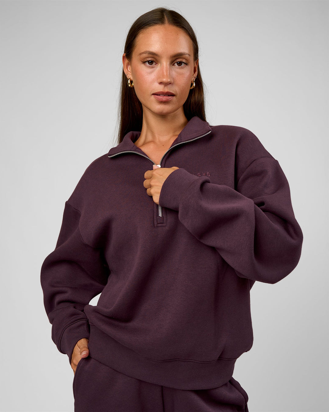 Woman wearing Go-To Oversized Quarter Zip Sweater - Midnight Plum | Model:Brylee | Size:XS