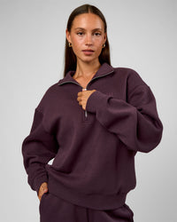 Woman wearing Go-To Oversized Quarter Zip Sweater - Midnight Plum | Model:Brylee | Size:XS