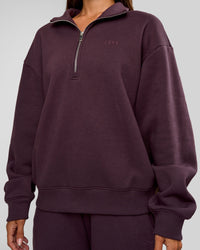 Woman wearing Go-To Oversized Quarter Zip Sweater - Midnight Plum | Model:Brylee | Size:XS