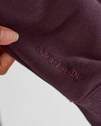 Woman wearing Go-To Oversized Quarter Zip Sweater - Midnight Plum | Model:Brylee | Size:XS