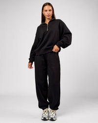 Woman wearing Go-To Oversized Track Pant - Black | Model:Brylee | Size:XS