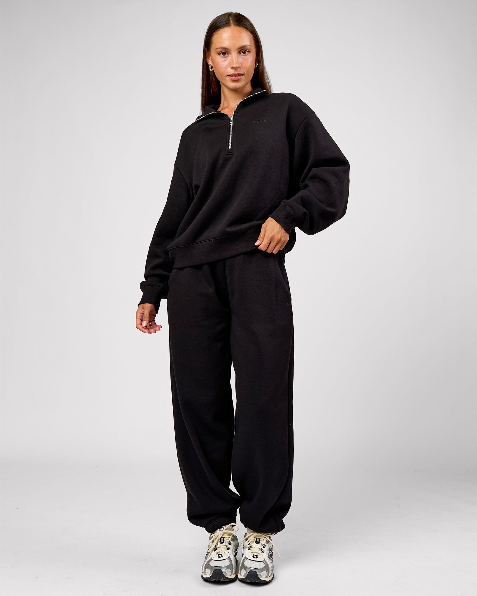 Woman wearing Go-To Oversized Track Pant - Black | Model:Brylee | Size:XS