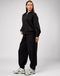 Woman wearing Go-To Oversized Track Pant - Black | Model:Brylee | Size:XS | Thumbnail Index: 4