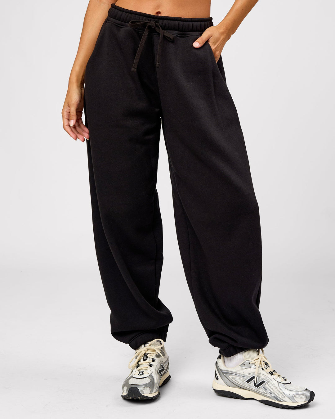 Woman wearing Go-To Oversized Track Pant - Black | Model:Brylee | Size:XS - view 6