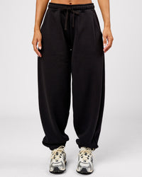 Woman wearing Go-To Oversized Track Pant - Black | Model:Brylee | Size:XS