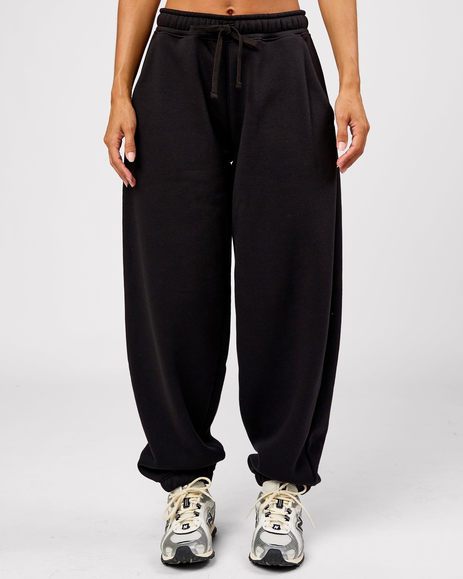 Woman wearing Go-To Oversized Track Pant - Black | Model:Brylee | Size:XS