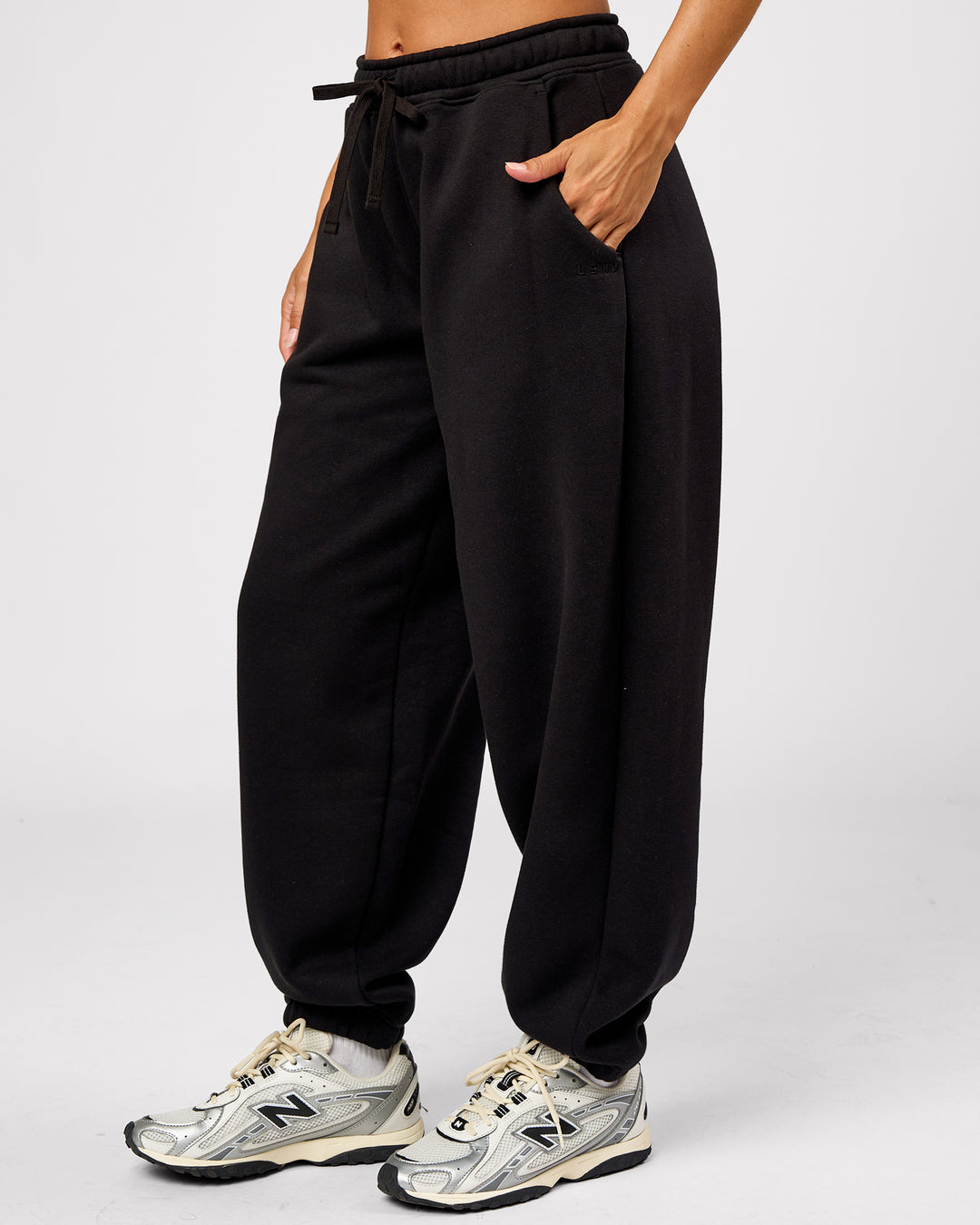 Woman wearing Go-To Oversized Track Pant - Black | Model:Brylee | Size:XS