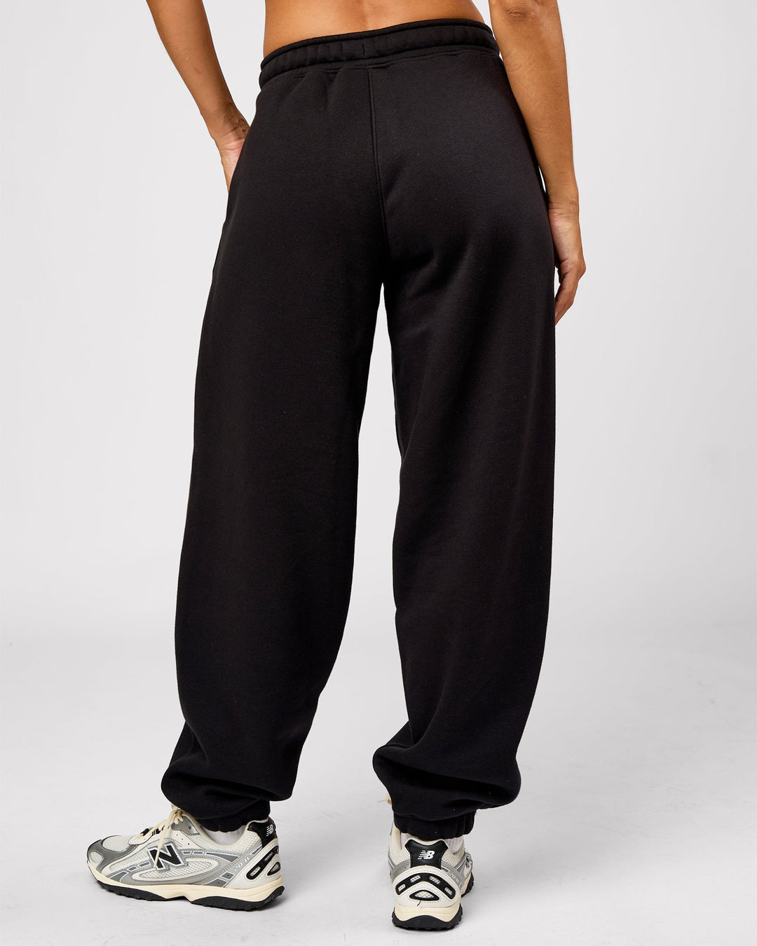 Woman wearing Go-To Oversized Track Pant - Black | Model:Brylee | Size:XS - view 4