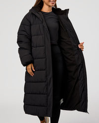 Woman wearing Go-To Puffer Long Jacket - Black | Model:Brylee | Size:XS