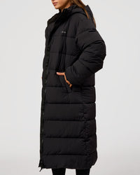 Woman wearing Go-To Puffer Long Jacket - Black | Model:Brylee | Size:XS