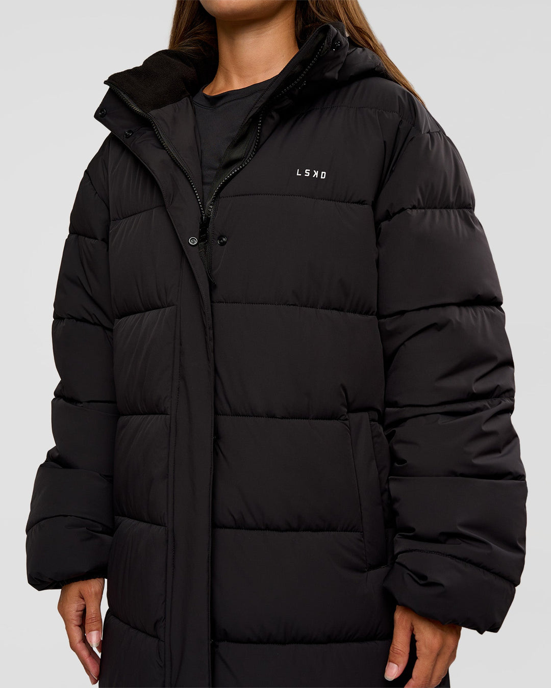 Woman wearing Go-To Puffer Long Jacket - Black | Model:Brylee | Size:XS