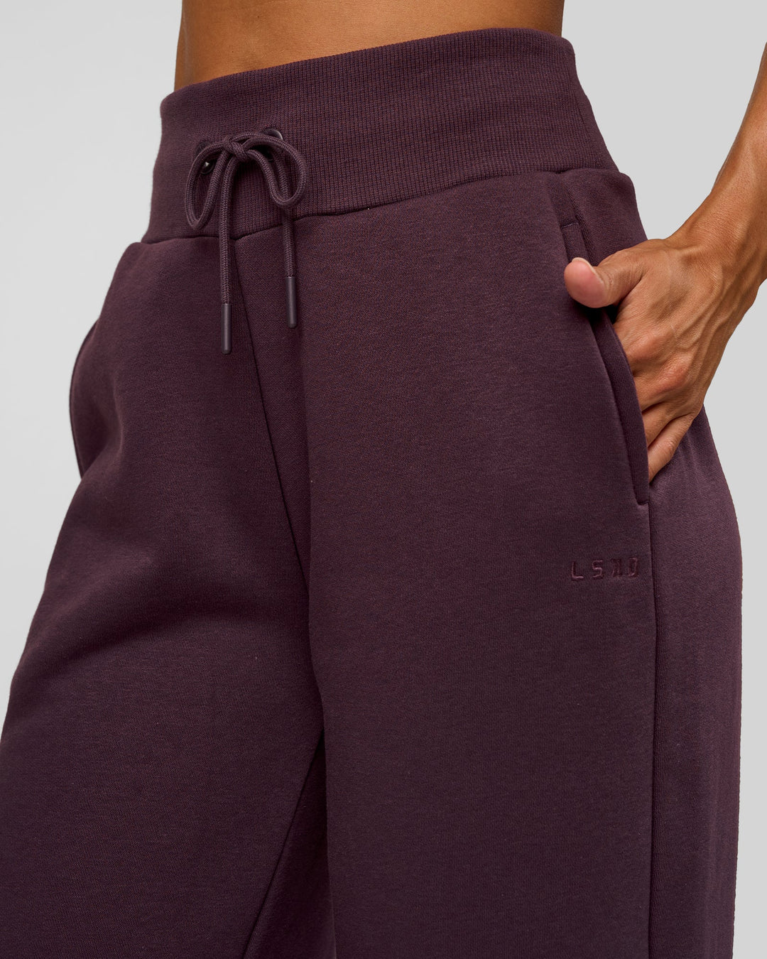 Woman wearing Go-To Wide Leg Track Pant - Midnight Plum | Model:Rhiley | Size:XS