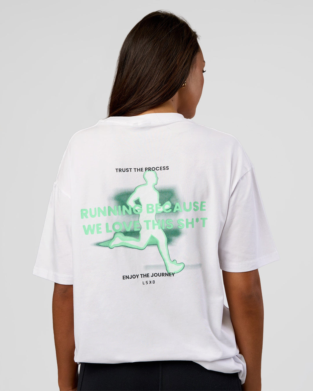 Woman wearing High Run FLXCotton Oversized Tee - White-Jelly Mint | Model:Kirstyn | Size:XS