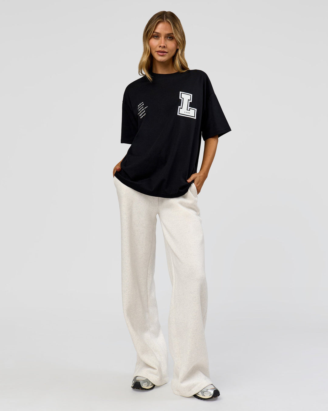 Woman wearing Hype Heavyweight Unisex Oversized Tee - Black-White | Model:Leilani | Size:XS
