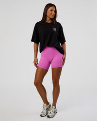 Woman wearing Inferno Journey FLXCotton Oversized Tee - Black-Ultra Fuchsia | Model:Bianca | Size:XS