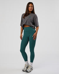 Woman wearing Inferno Journey FLXCotton Oversized Tee - Dark Storm Washed-Iceberg Green | Model:Bianca | Size:XS