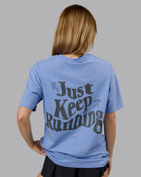 Woman wearing Just Run FLXCotton Oversized Tee - Soft Blue-Dark Storm | Model:Emilie | Size:XS