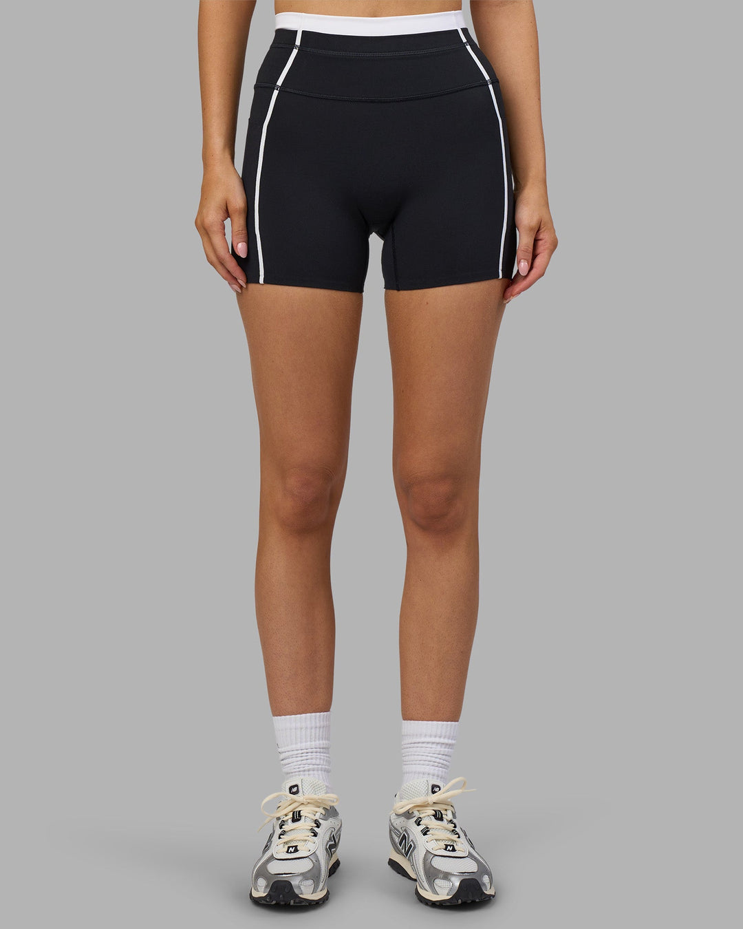 Woman wearing Liberate Contrast High-Rise 4" Short Pockets - Black-White | Model:Leilani | Size:XS