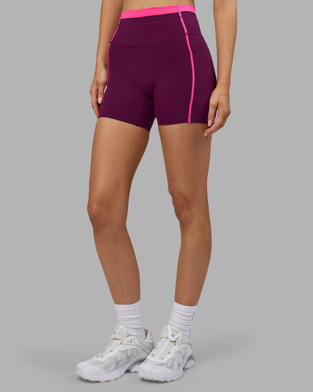 Woman wearing Liberate Contrast High-Rise 4" Short Pockets - Plum Caspia-Ultra Pink | Model:Leilani | Size:XS