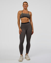 Woman wearing Liberate High-Rise Full Length Legging Pockets in Duskstone-Black | Model:Maja | Size:XS