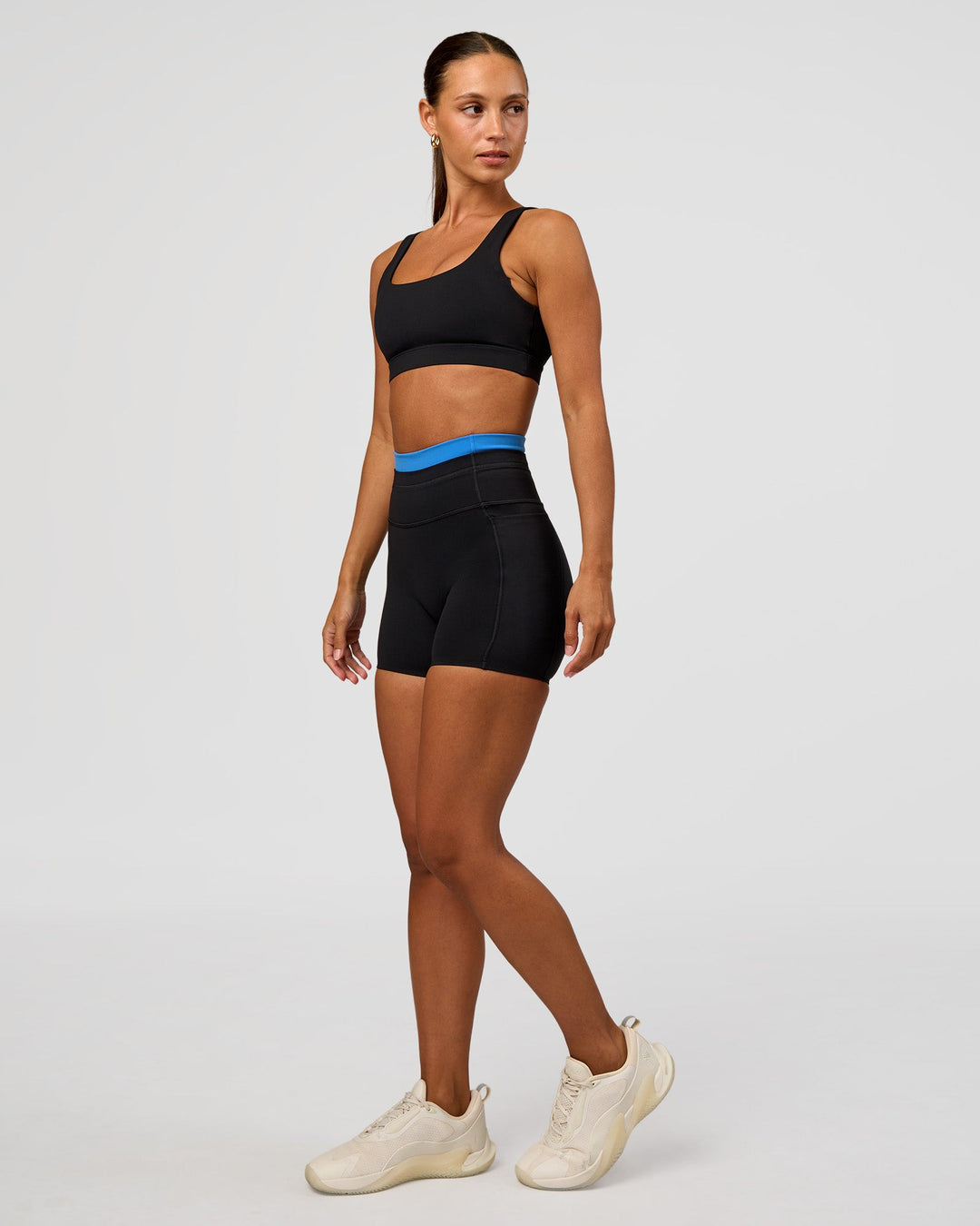 Woman wearing Liberate High-Rise 4" Short Pockets - Black-Palace Blue | Model:Brylee | Size:XS