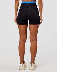 Woman wearing Liberate High-Rise 4" Short Pockets - Black-Palace Blue | Model:Brylee | Size:XS