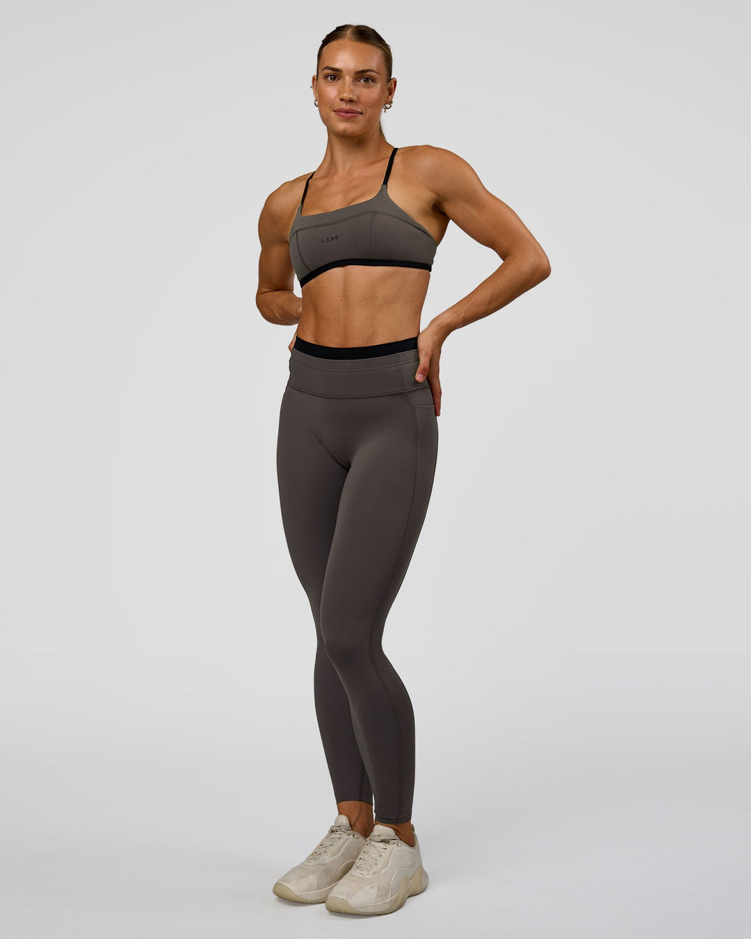 Woman wearing Liberate Sports Bra in Duskstone-Black | Model:Maja | Size:XS