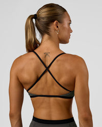 Woman wearing Liberate Sports Bra in Duskstone-Black | Model:Maja | Size:XS