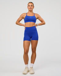 Woman wearing Lift Sports Bra - Electric Indigo | Model:Maja | Size:XS