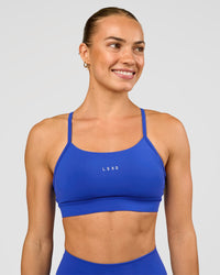 Woman wearing Lift Sports Bra - Electric Indigo | Model:Maja | Size:XS