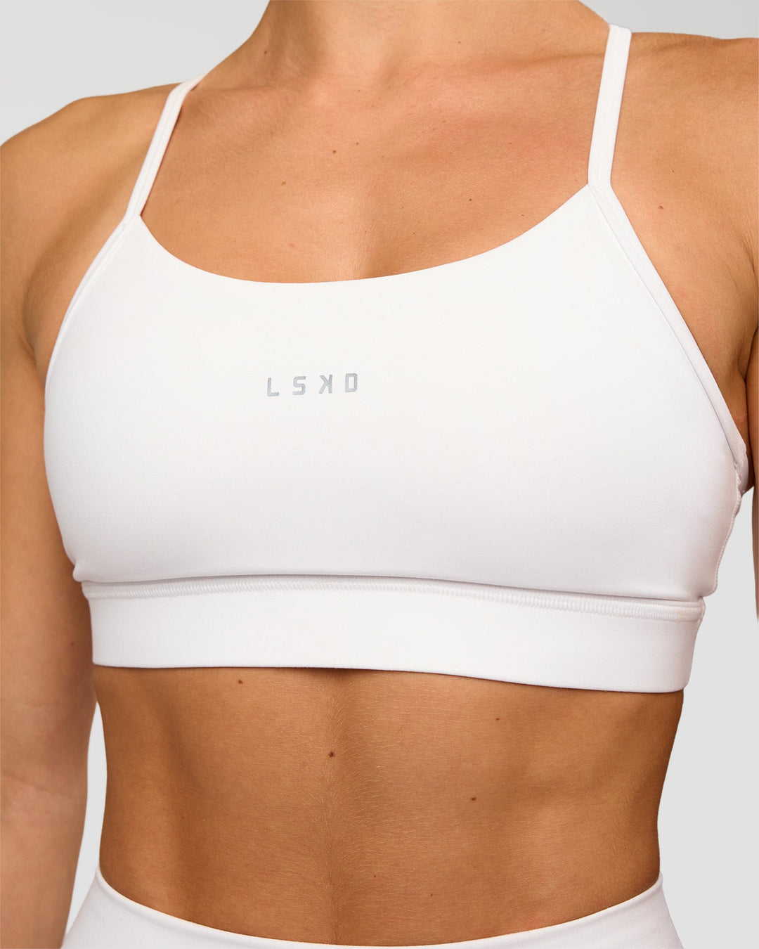 Woman wearing Lift Sports Bra - White | Model:Maja | Size:XS